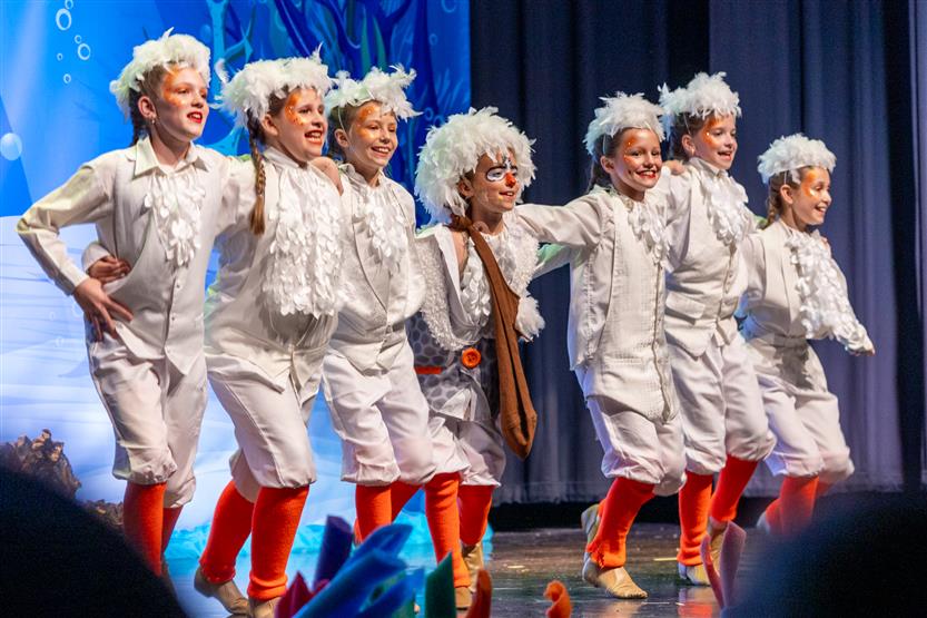Students perform onstage